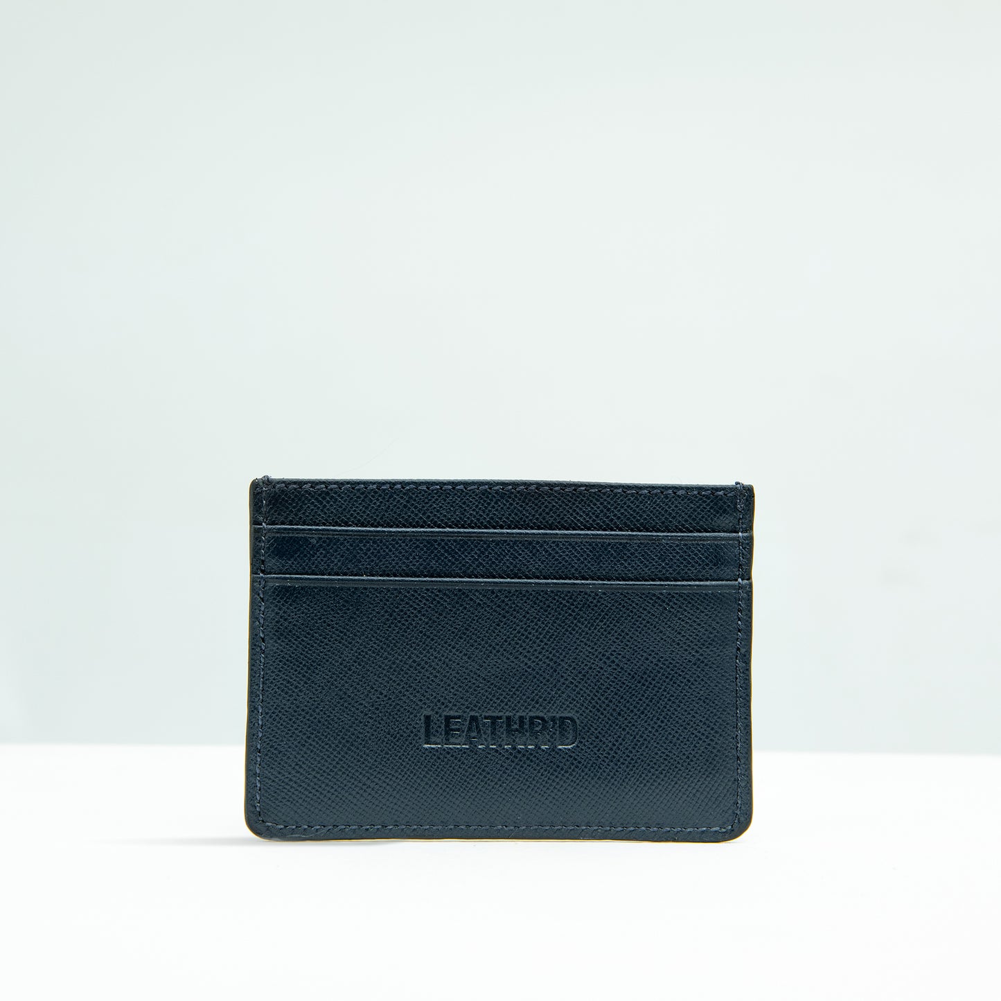 The Dī́jaw Card-holder in Navy